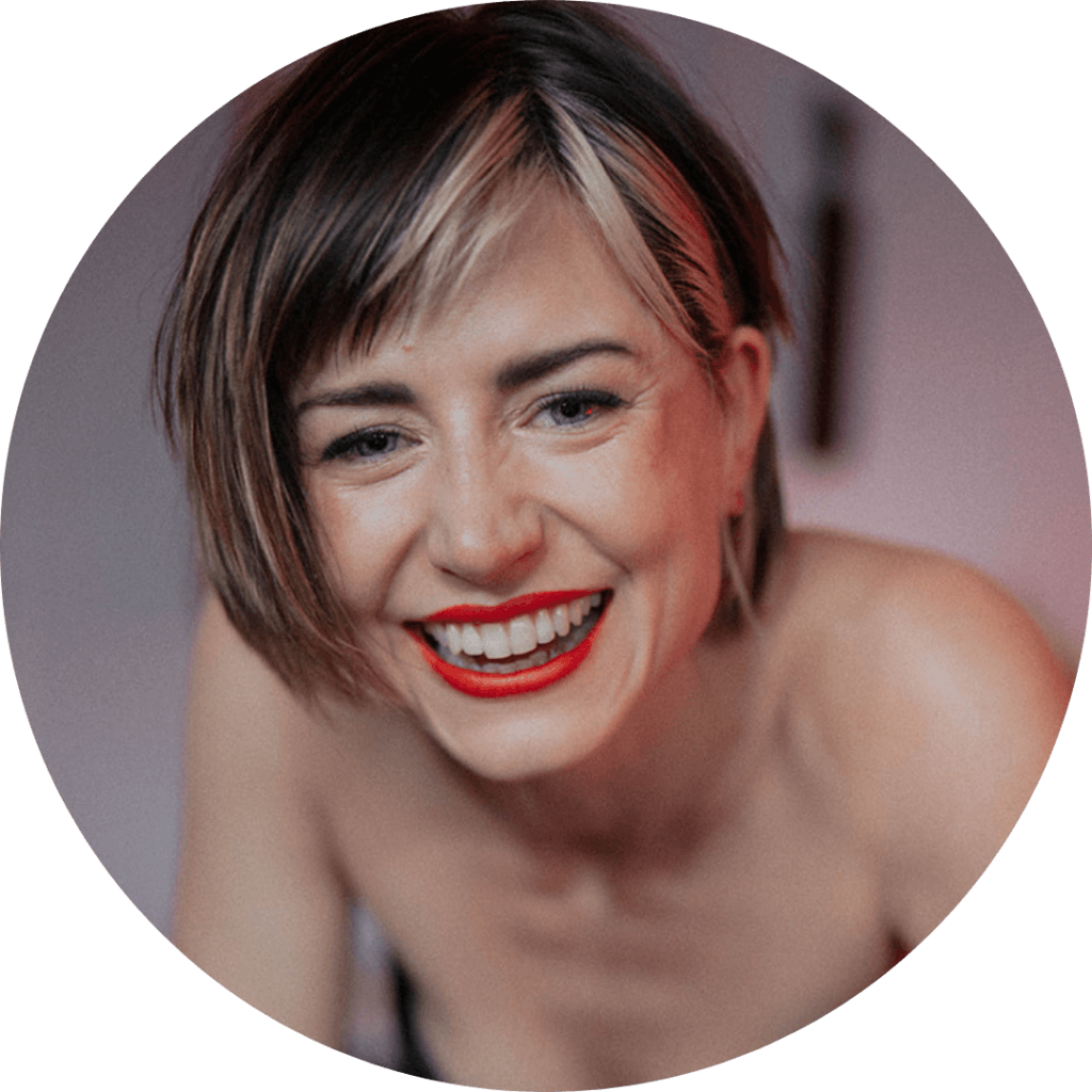 Happy woman with short hair and red lipstick smiling